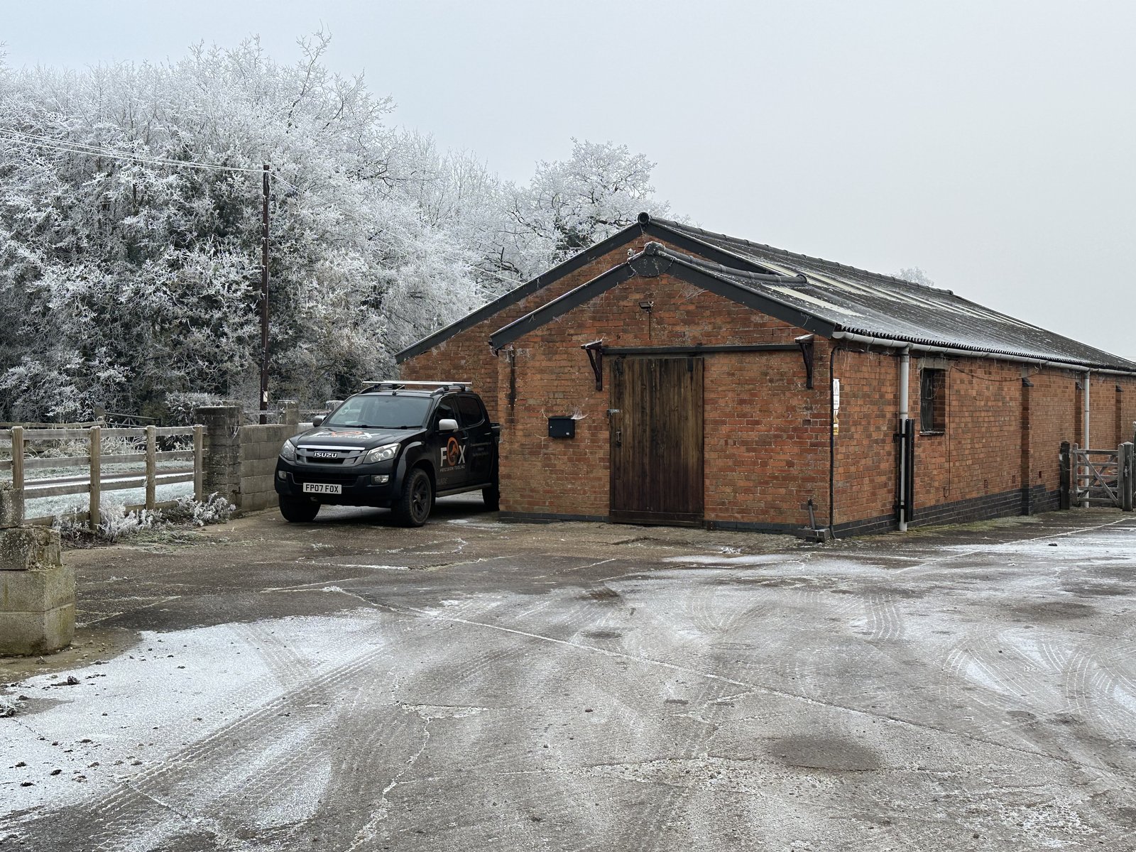 The converted cattle shed in Ashbourne, Derbyshire where Fox Precision Tooling started, with the company van parked outside