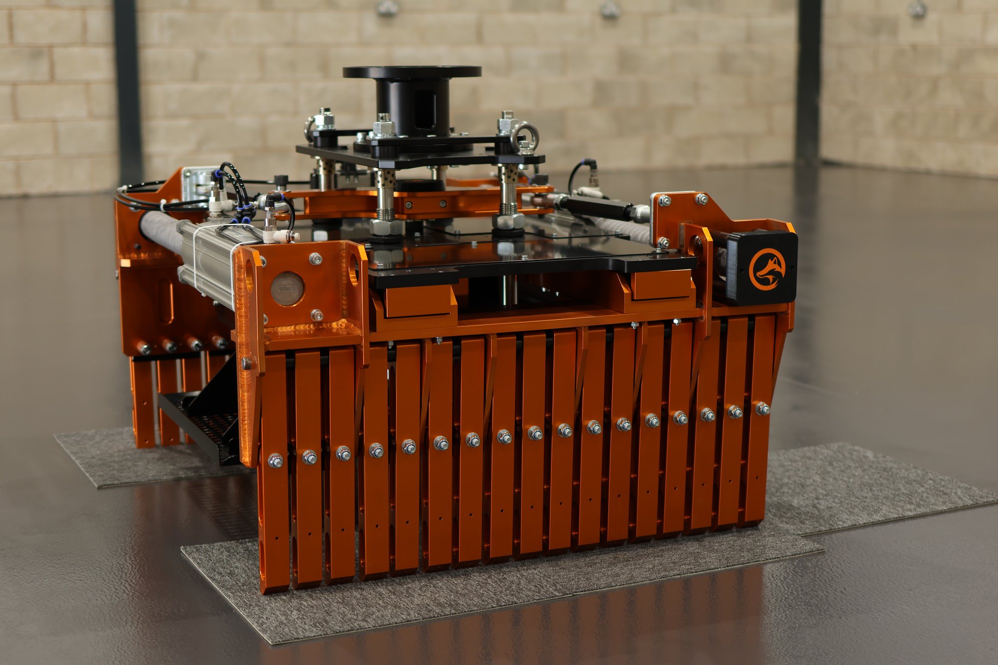 Fox Precision Tooling multi-finger brick gripper, orange mounting plates and mechanical fingers