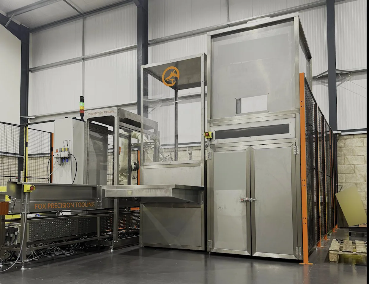 Fox Precision Tooling Adaptive Container Cell - two robot container reprocessing cell with lid pick robot, wash tower and guarded infeed conveyor