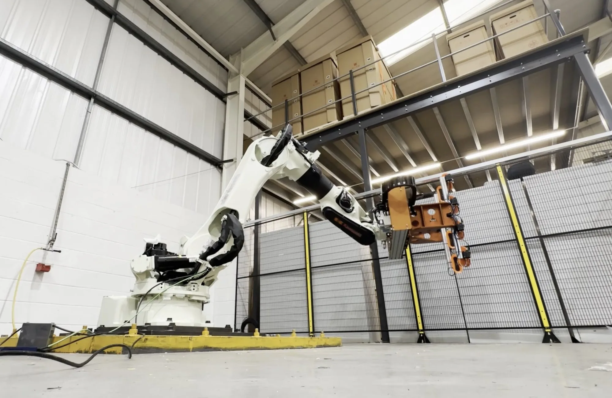 Fox Precision Tooling Adaptive Cylinder EOAT - six axis robot picking an insulated hot water cylinder with an adaptive vacuum EOAT