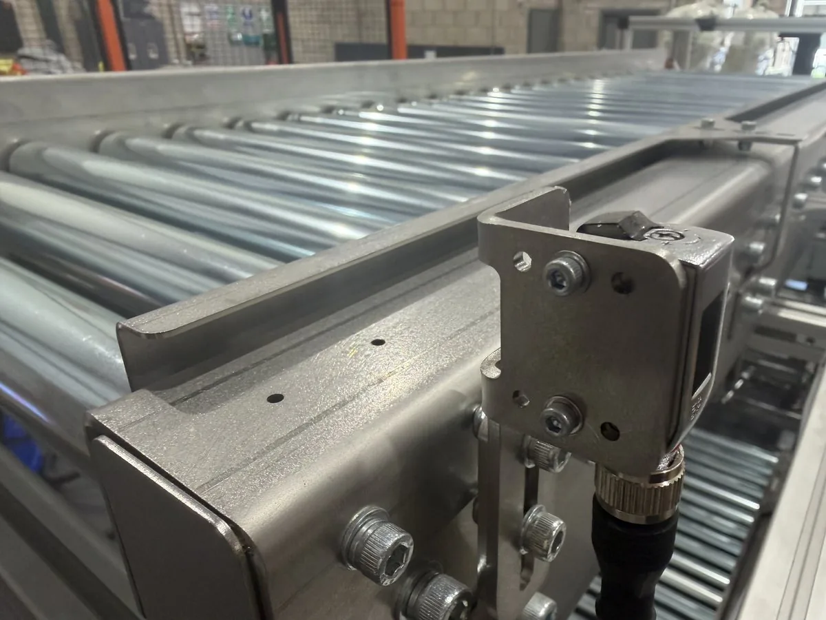 Drive unit and sensor mounting detail on a Fox Precision Tooling conveyor