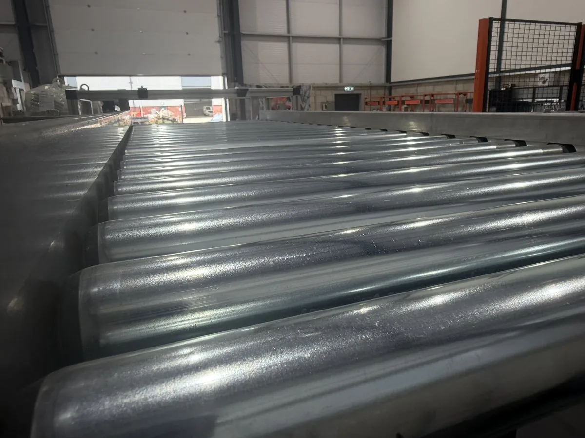 Roller conveyor line running through the Fox Precision Tooling workshop